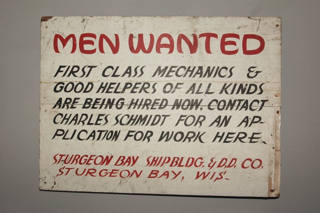 A sign that is open to work: men wanted first class mechanics and good helpers of all kinds.